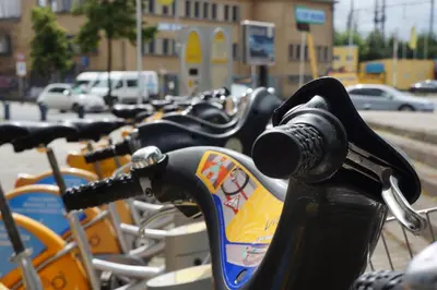 a row of bikes parked on a street at Escale Hotel in Brussels