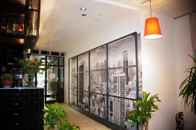 a black and white picture on a wall in a restaurant at Escale Hotel in Brussels