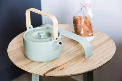 a table with a tea pot and a loaf of bread at Brussels St Gilles Elegant residence in Brussels