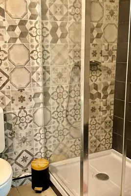 a bathroom with a shower and a toilet at Happy Home in Brussels