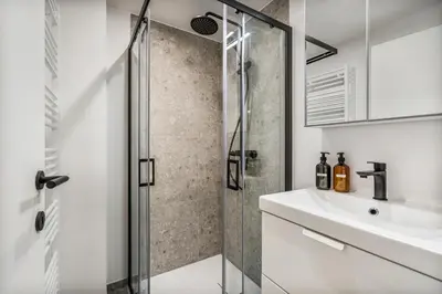 a bathroom with a shower and a sink at Gezellige Gentse Studio - Perfect Voor Koppels in Ghent