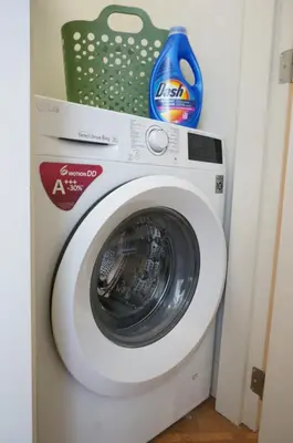 a washing machine with a basket on top of it at Charming duplex apartment with spectacular views in Antwerp