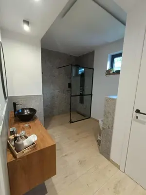 a bathroom with a sink and a shower at het Boekenhof in Niel