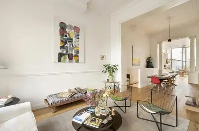 a living room with a couch and a table at Cozy Room with Garden in Brussels
