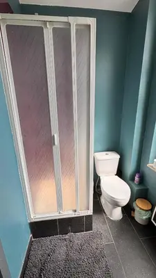 a bathroom with a shower and a toilet at T2 Neuf Quartier Calme central et transport devant in Brussels