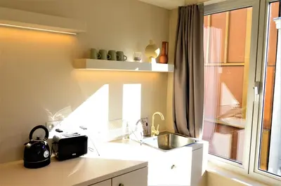 a kitchen with a sink and a window at Japandi Lofts - 2 Bedrooms at old city of Antwerp in Antwerp