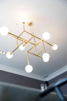 a chandelier hanging from the ceiling in a room at The Haven in Sint-Genesius-Rode