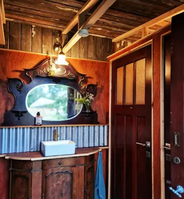 a bathroom with a sink and a mirror at Strackxhoeve Yurt 'Haardpeer' in Laakdal