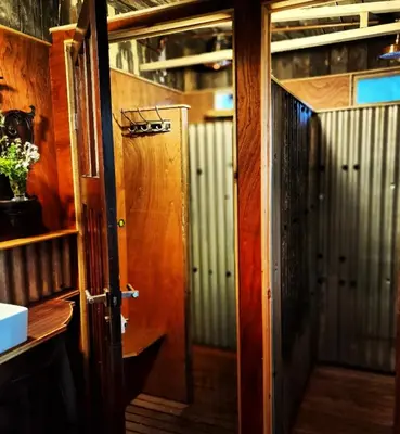 an open door to a hallway in a train at Strackxhoeve Yurt 'Haardpeer' in Laakdal