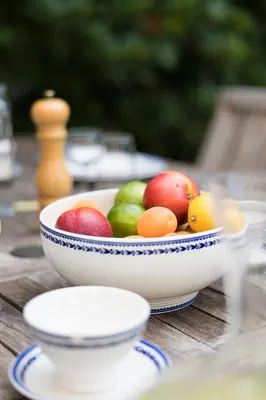 a bowl of fruit on a wooden table at The Castle in Brussels