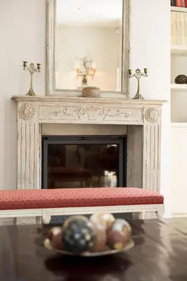 a plate of eggs on a table in front of a fireplace at The Castle in Brussels