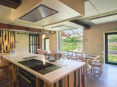 a kitchen and dining room with a table and chairs at Lactea in Schilde