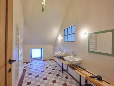 a bathroom with two sinks and a mirror at Lactea in Schilde