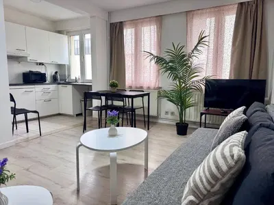 a living room with a couch and a table at Breughel Apartments in Antwerp