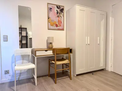 a room with a desk and a chair and a table at Breughel Apartments in Antwerp
