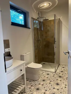 a bathroom with a shower and a toilet and a sink at Holiday House Nature in Lier