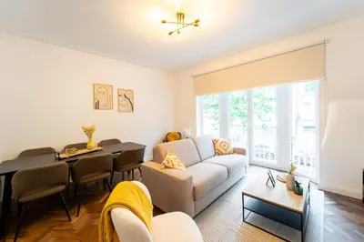 a living room with a couch and a table at Family-Friendly 2-Bedroom Apartment in Antwerp in Antwerp