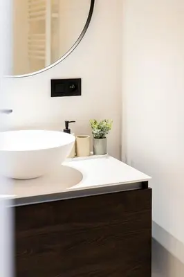 a bathroom with a sink and a mirror at Family-Friendly 2-Bedroom Apartment in Antwerp in Antwerp