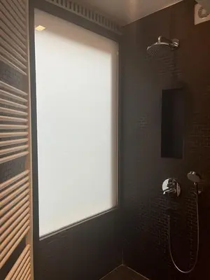 a large window in a bathroom with a shower at Entresol28 in Brussels