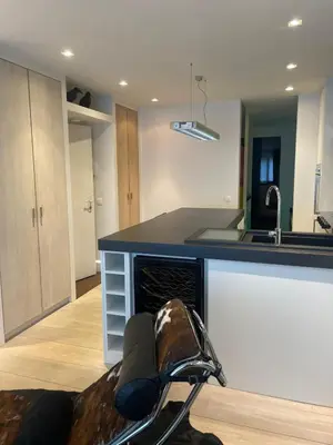 a kitchen with a counter and a sink and a stove at Entresol28 in Brussels