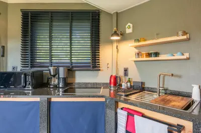 a kitchen with a sink and a counter top at Octagoon in Tessenderlo