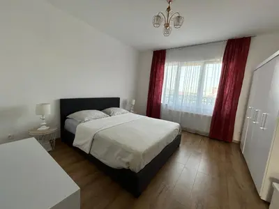 a bedroom with a bed and a large window at MiMi in Brussels