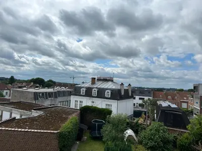 a view from the roof of a white house at MiMi in Brussels
