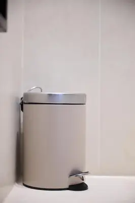 a white bucket sitting on top of a white wall at Apartment Forest Center 2 in Brussels