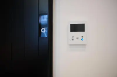 a door with an electrical device on a wall at Apartment Forest Center 2 in Brussels
