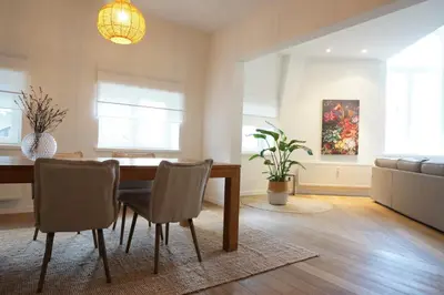 a dining room with a table and chairs at Charming, spacious & luxurious - 2-bedroom apartment at wonderful location in Antwerp