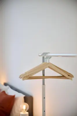 a glass table in front of a bed at Apartment La Barrière 6 in Brussels