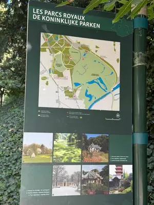 a sign on a pole with a map at Atomium Brussels Canopy in Brussels