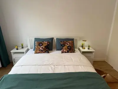 a bedroom with a large white bed with pillows at Atomium Brussels Canopy in Brussels