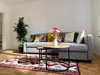 a living room with a couch and a table at Atomium Brussels Canopy in Brussels