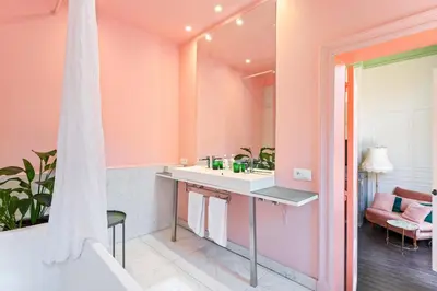 a bathroom with a sink and a mirror at Boutique Cogels Osy in Antwerp