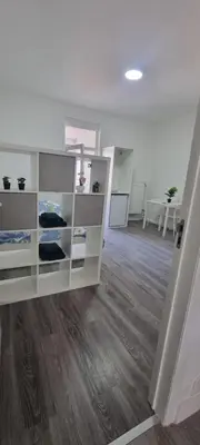 a room with a white book shelf in a room at CitySpot 159 in Brussels