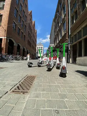 a row of street lights on a city street at Grote Markt suite 3 in Antwerp