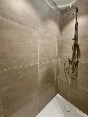 a bathroom with a shower and a toilet at Urban Nest - Brussels in Brussels