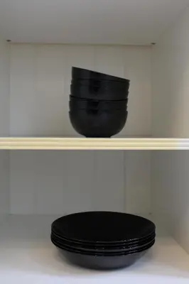 a black toilet on a shelf with a black bowl at Diesters huisje in Diest