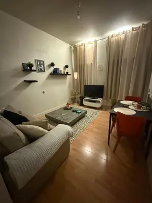 a living room with a couch and a table at Antwerpen duplex apartment in Antwerp