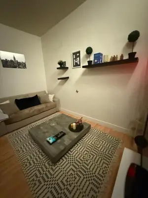 a living room with a couch and a table at Antwerpen duplex apartment in Antwerp