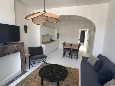 a living room with a couch and a table at T' Suikerklontje in Antwerp