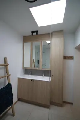 a bathroom with a sink and a skylight at Huisje Nostalgie in Laakdal