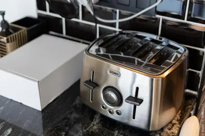 a toaster sitting on a counter in a kitchen at Ecstatic Living Ixelles, Luxury in the European Quarter in Brussels