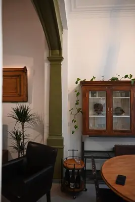 a room with a pillar and a table and a cabinet at P60 Character & Comfort in 1000 Brussels in Brussels