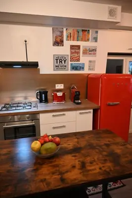 a kitchen with a bowl of fruit on a table at Vintage Soul, Green Vibes, Heart of the City in Brussels