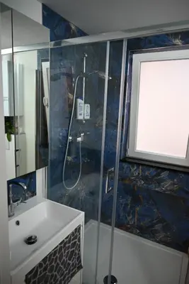a bathroom with a shower and a sink at Vintage Soul, Green Vibes, Heart of the City in Brussels