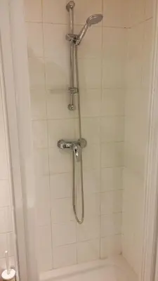 a shower with a shower head in a bathroom at Central and convenient studio near supermarkets and public transports in Brussels