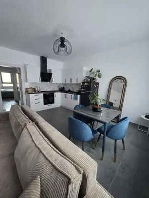 a living room with a couch and a table at Nord center 1G in Brussels