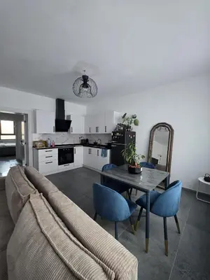 a living room with a couch and a table at Nord center 1G in Brussels